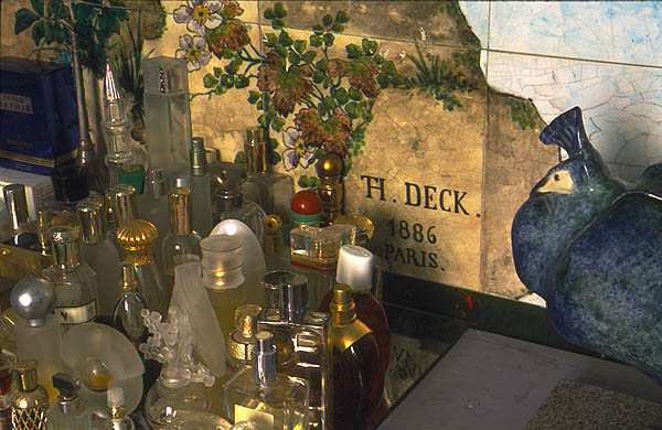 Design-statement perfume bottles meet the signed, hand-painted tiliing of Deck.