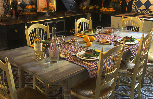 This intimate everyday family dining area has a more contemporary feel, with furnishings designed by Henri Quinta, and Catalan fabrics by Toiles du Soleil, which the family owns.